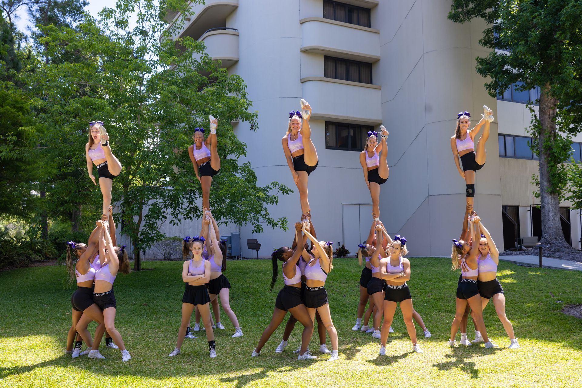 A group of cheerleaders are performing on a stage.