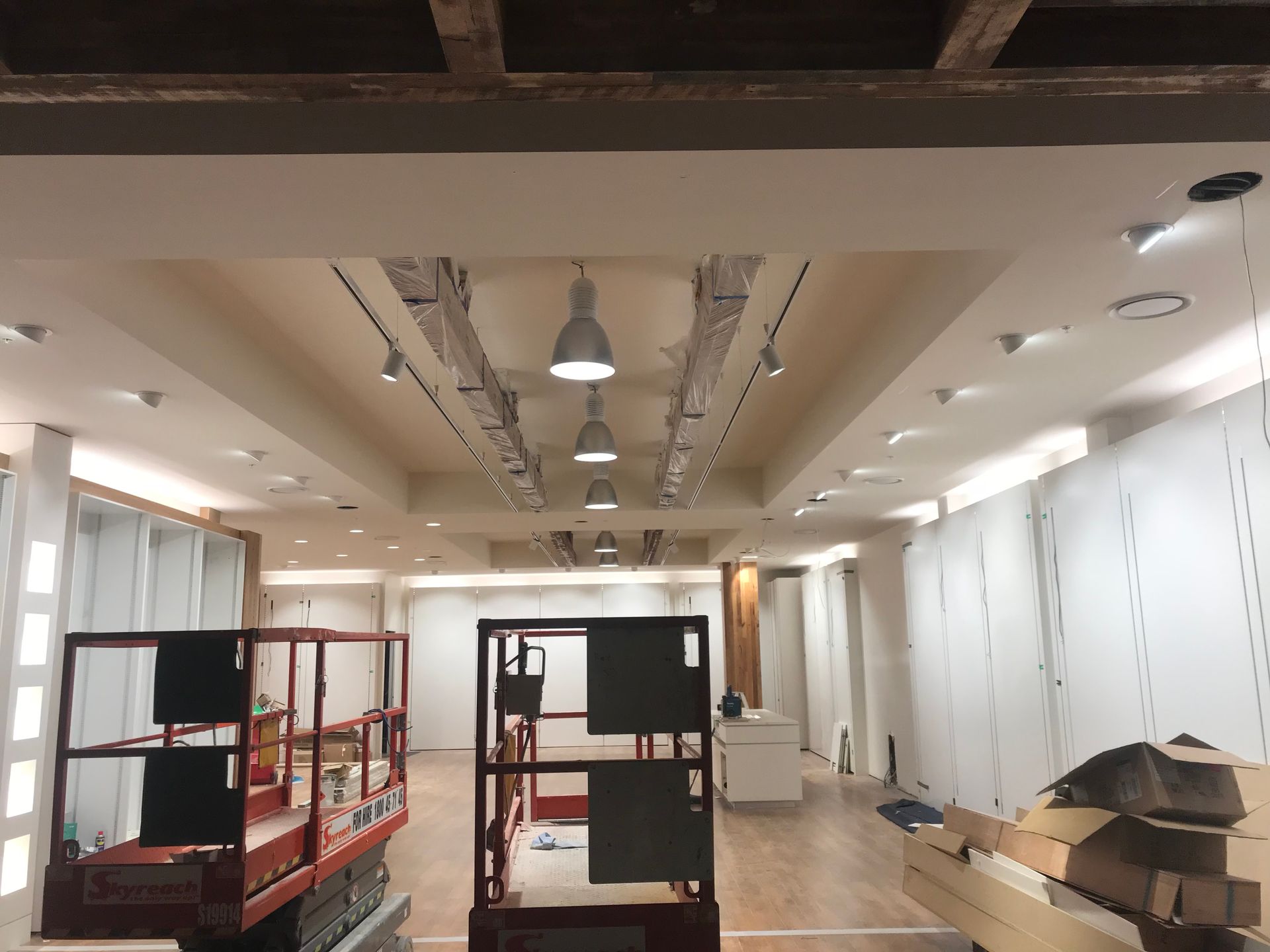 Lighting is being installed in a commercial space — Aliance Group in Bonville, NSW