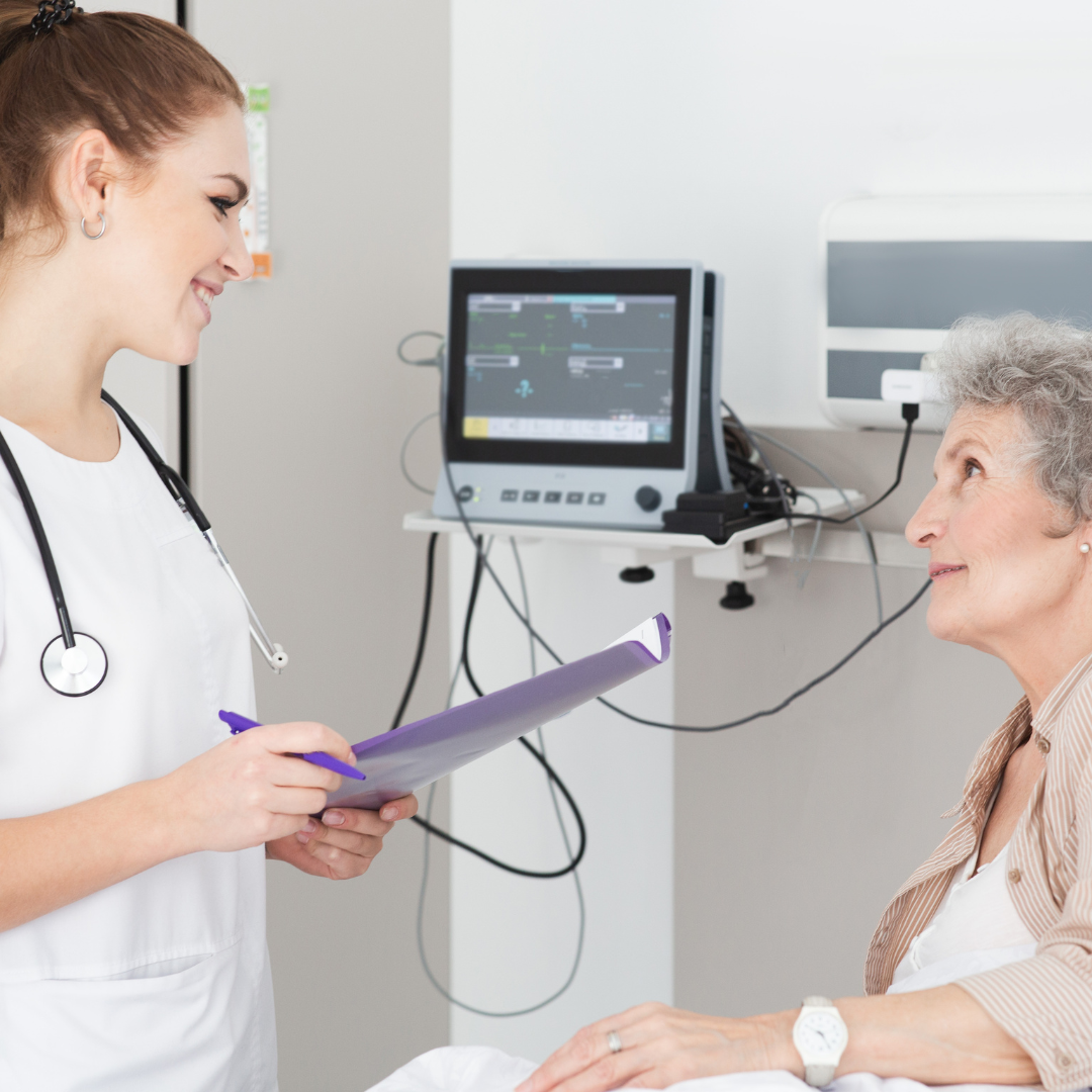 old woman talking to a caregiver