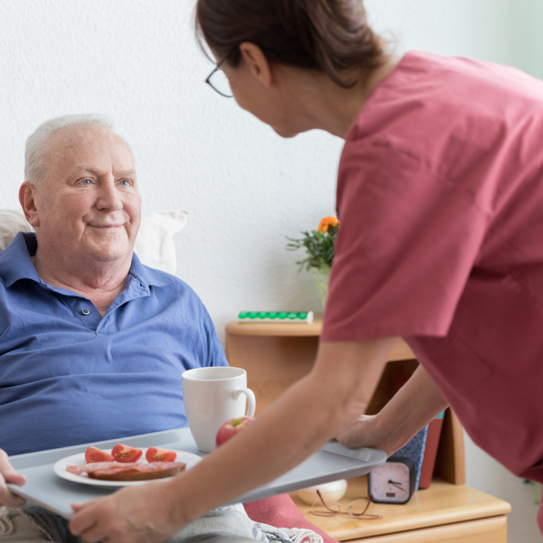 smiling elderly cared for by his caregiver
