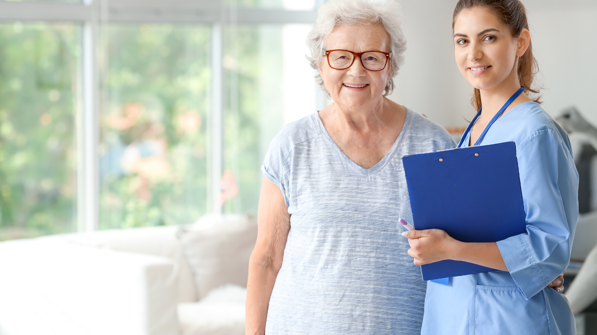 Elderly Woman with Caregiver in Nursing Home