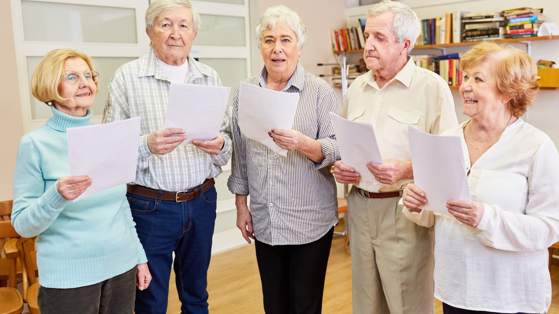 Group of Seniors with Dementia Singing in a Choir