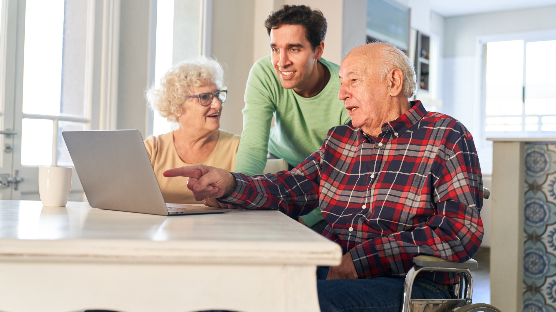 Son Helps Senior Parents at the Computer While Streaming Video