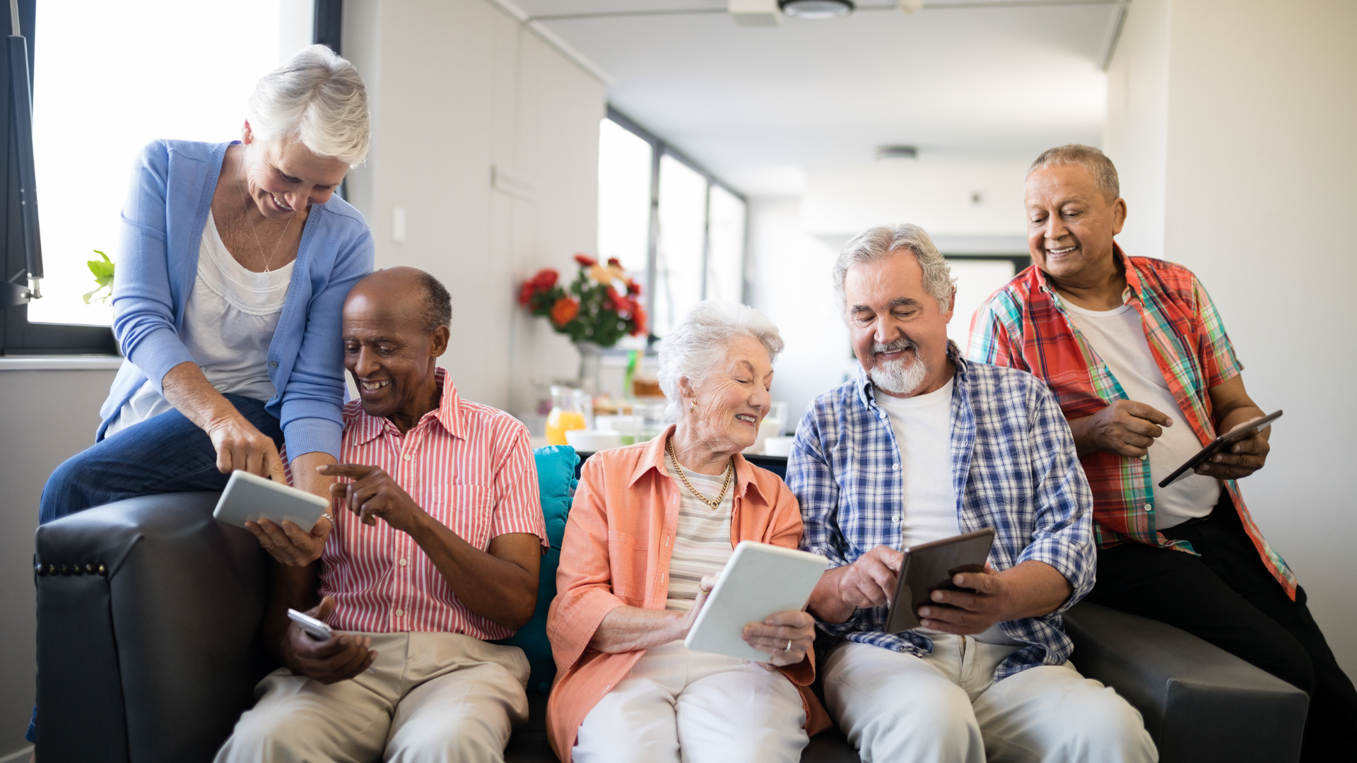 Happy senior people using tablet computers