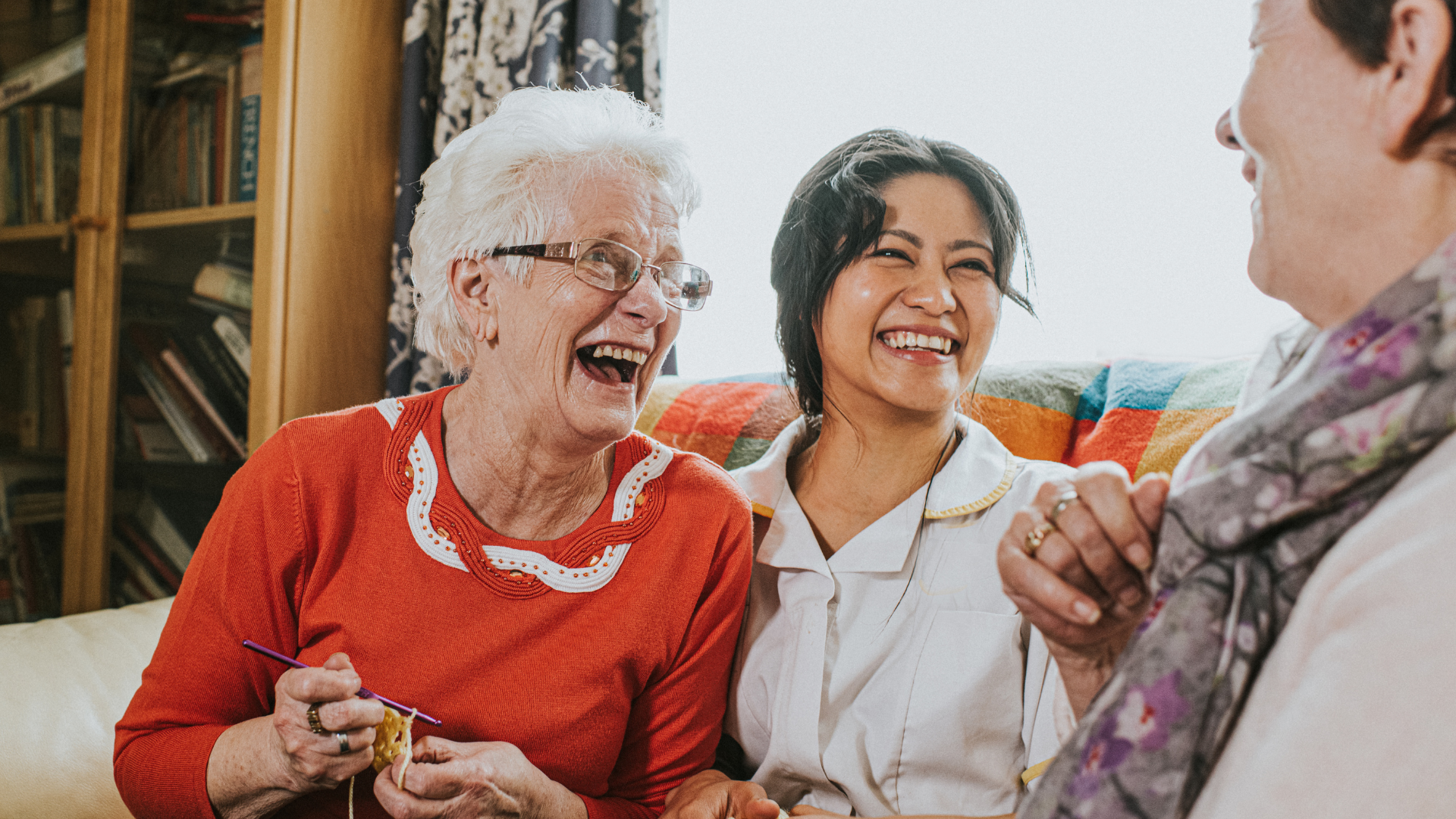 The care assistant visits an elderly woman