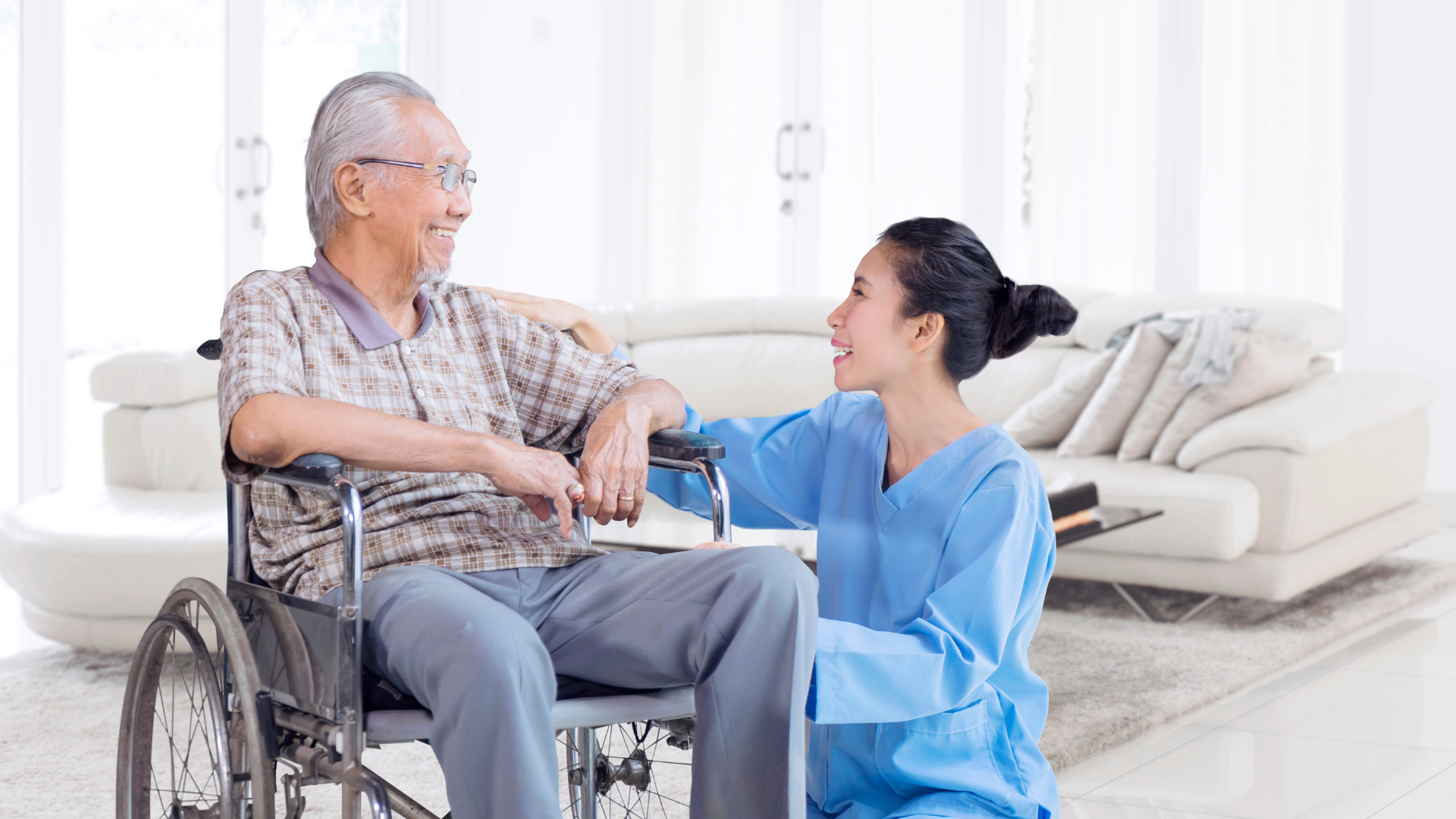 Happy Asian Elderly Man Talking with Nurse