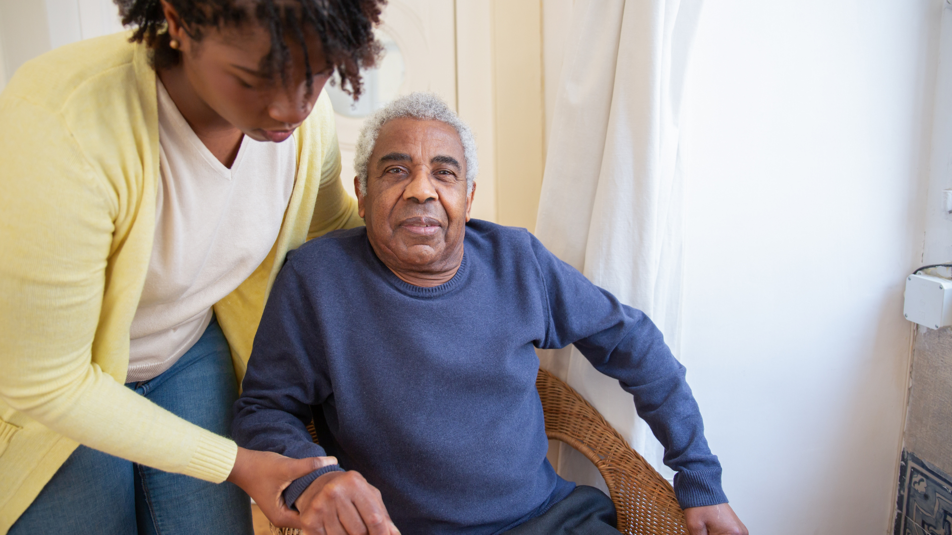 Woman Assisting Elderly Man