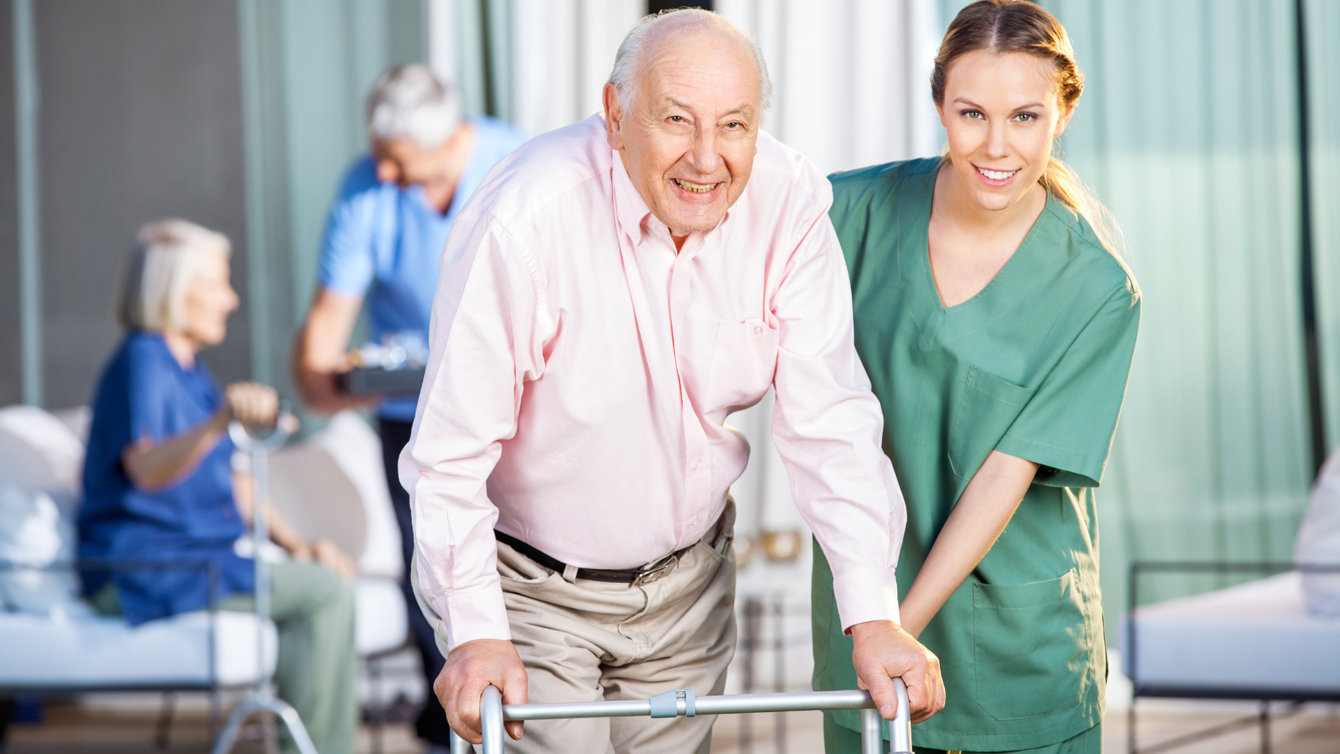 Female Caretaker Helping Senior Man in Using Zimmer Frame