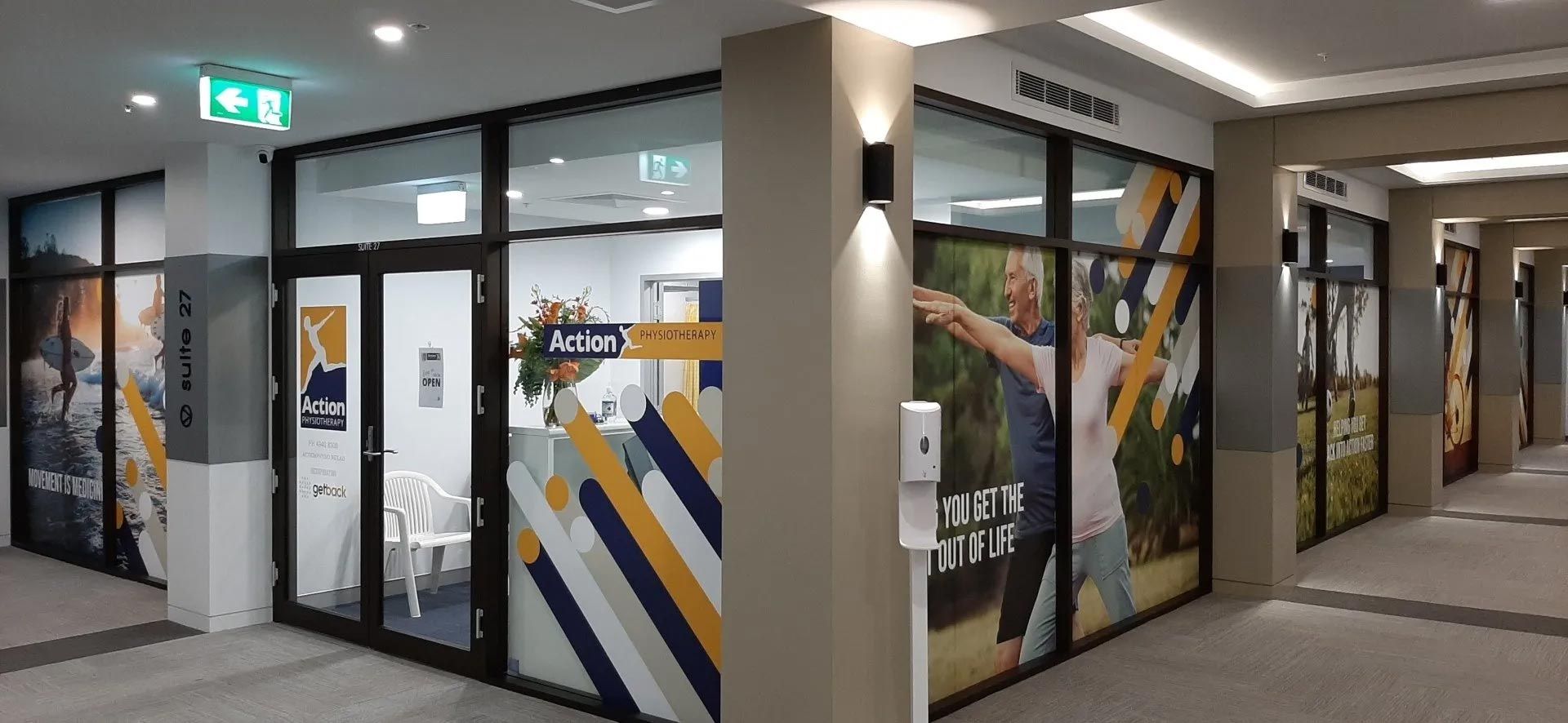 A Building with A Lot of Windows and A Lot of Advertisements on The Windows — Action Physiotherapy in Cooks Hill, NSW