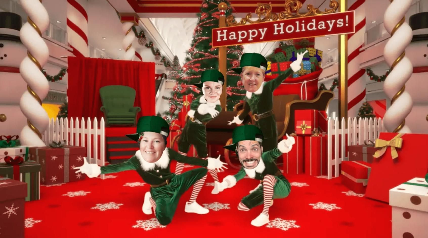 A Group of Elves Are Posing for A Picture with A Sign that Says Happy Holidays — Action Physiotherapy in Cooks Hill, NSW