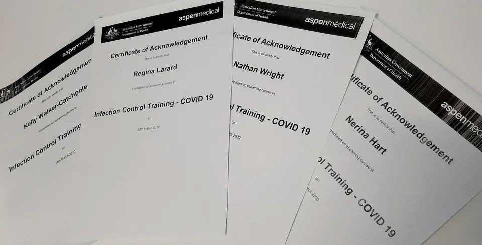 A Bunch of Papers Are Sitting on Top of Each Other on A Table — Action Physiotherapy in Cooks Hill, NSW