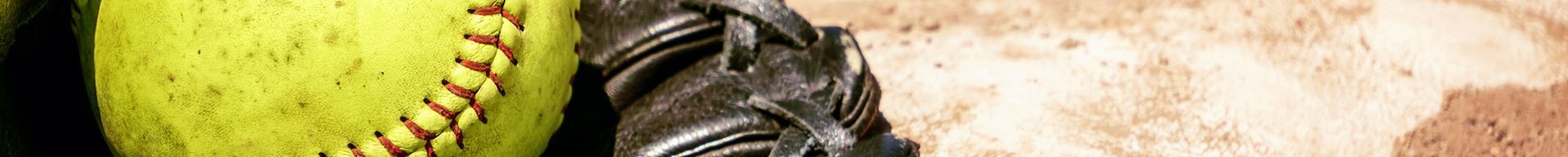 A close up of a person riding a motorcycle on a dirt road.