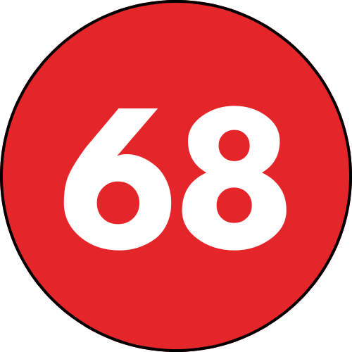 A white number 67 on a red circle with a black outline