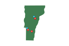 A green map of Vermont with red and blue dots on it.