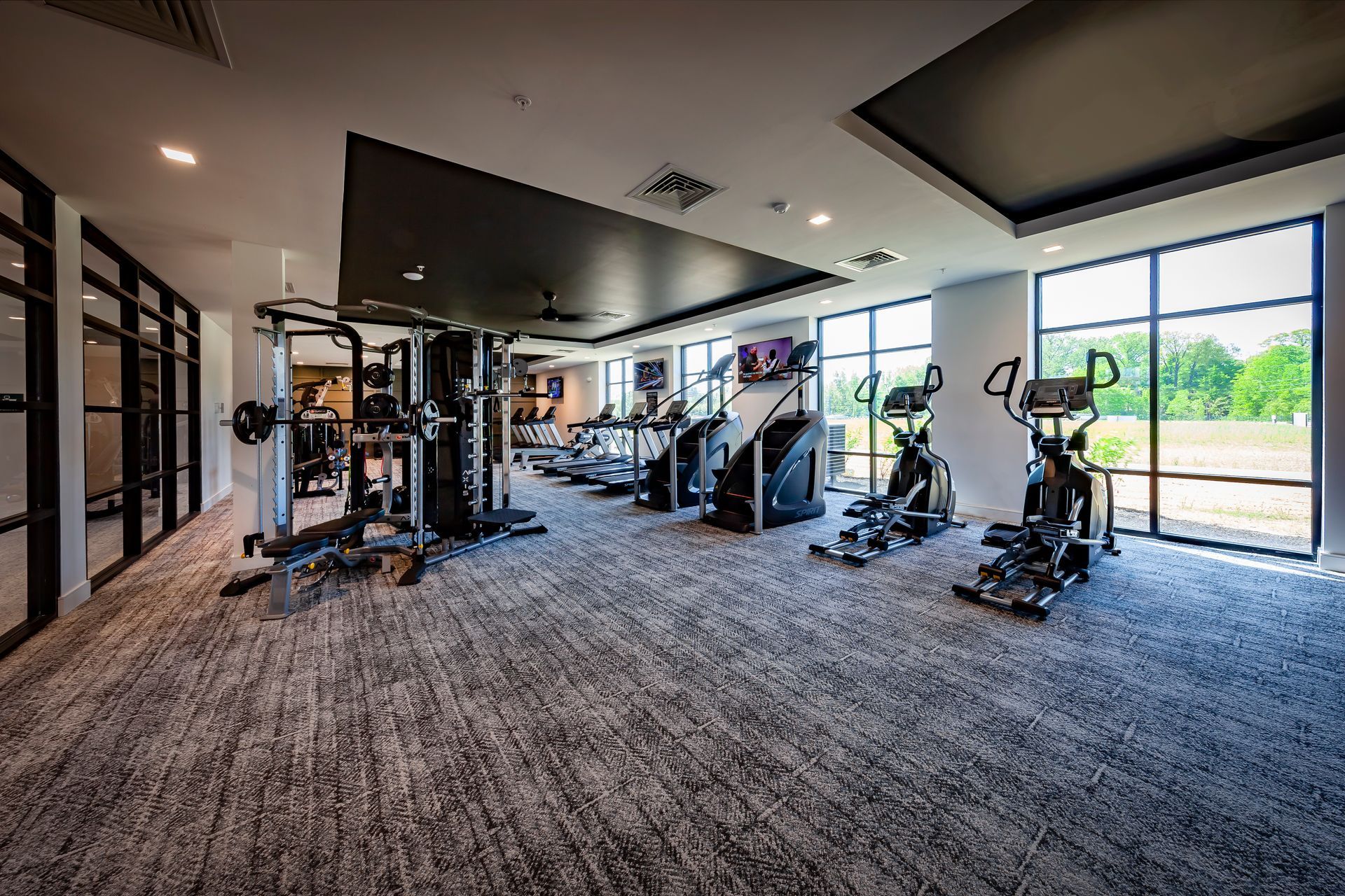 An artist 's impression of a gym with treadmills and benches.