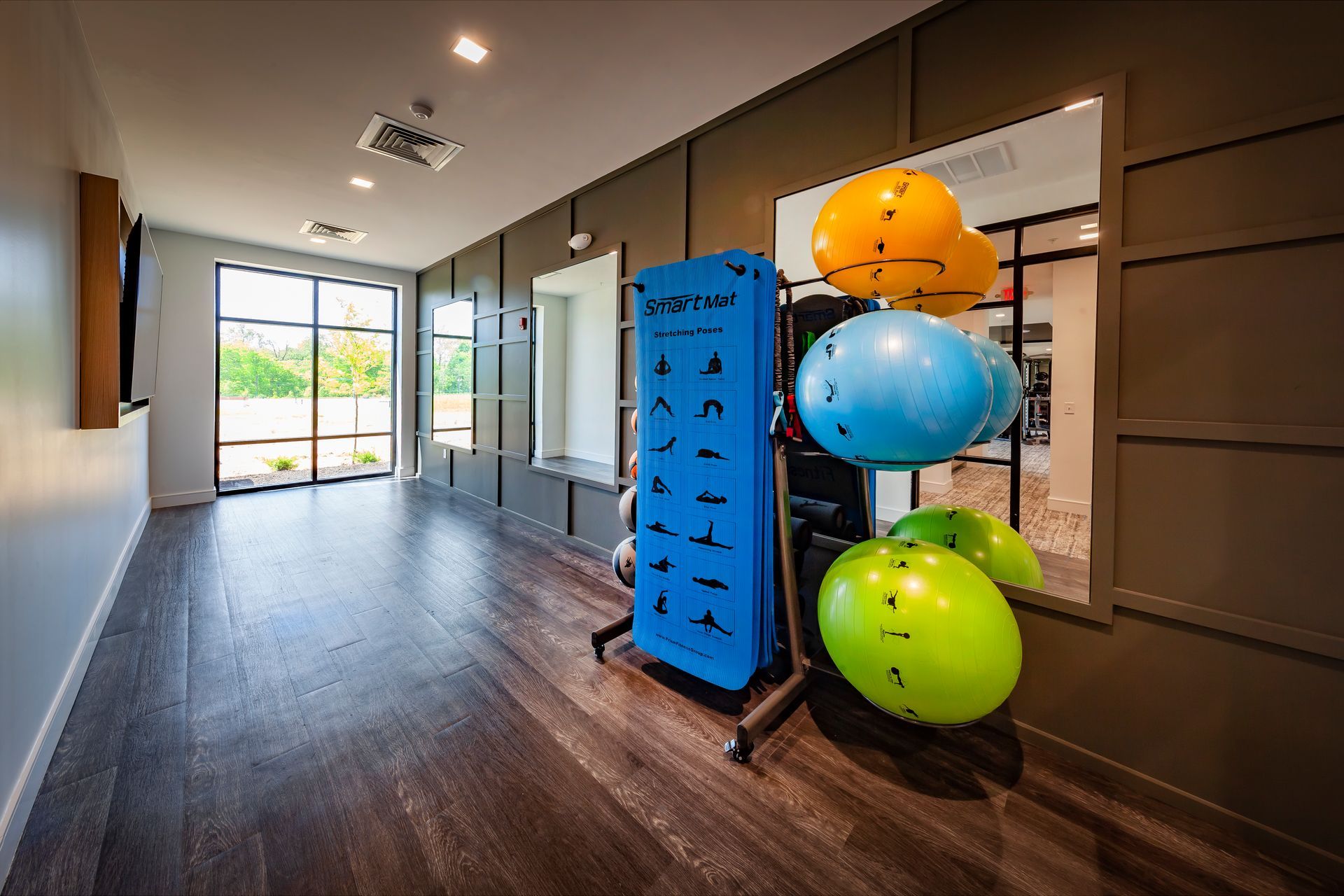 Gym interior with exercise balls and equipment at River Place Flats in Fishers, IN.