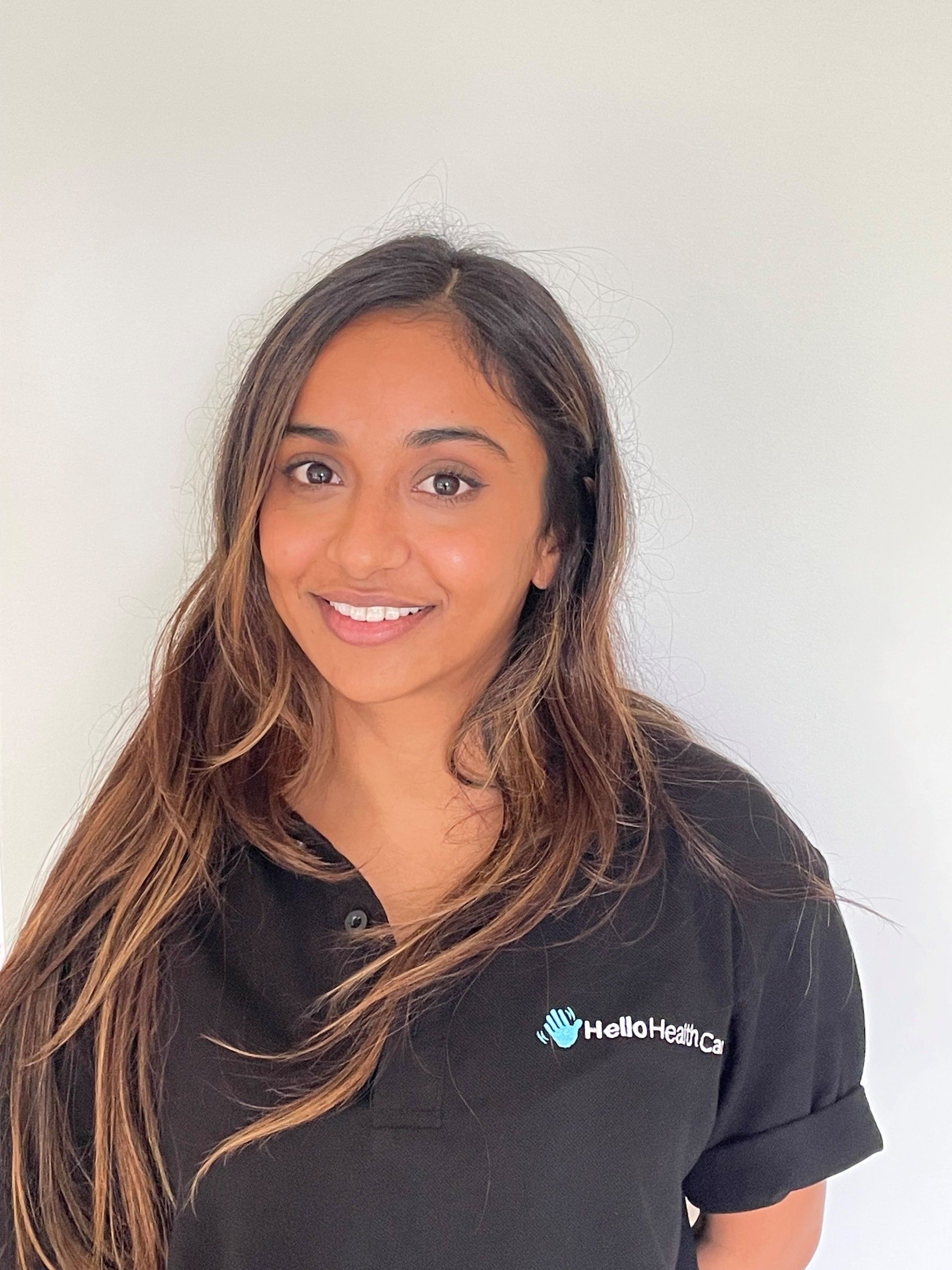 A close up of a woman 's face with a brown background.