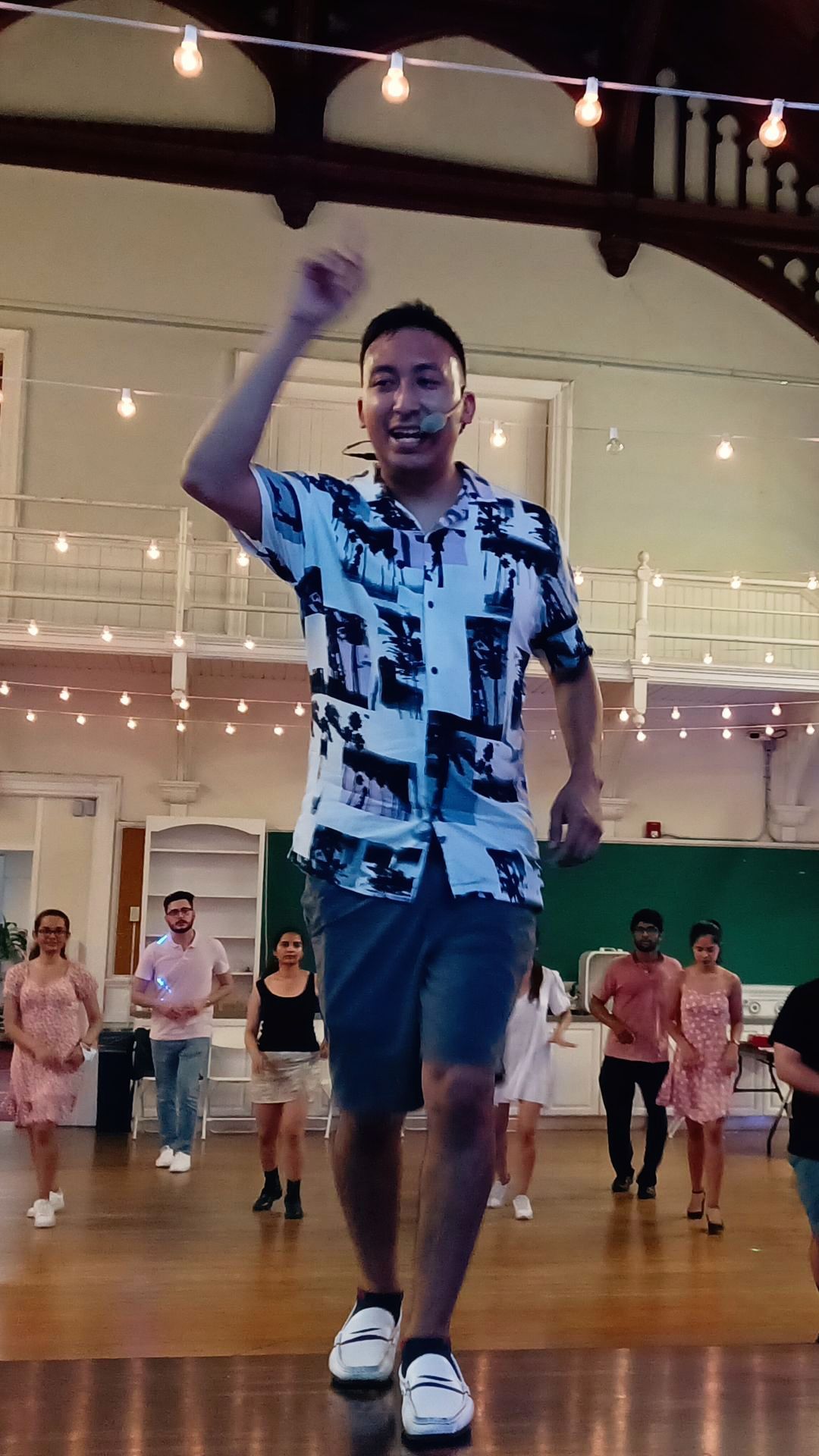 A woman is dancing on a poster for heels training beginner.