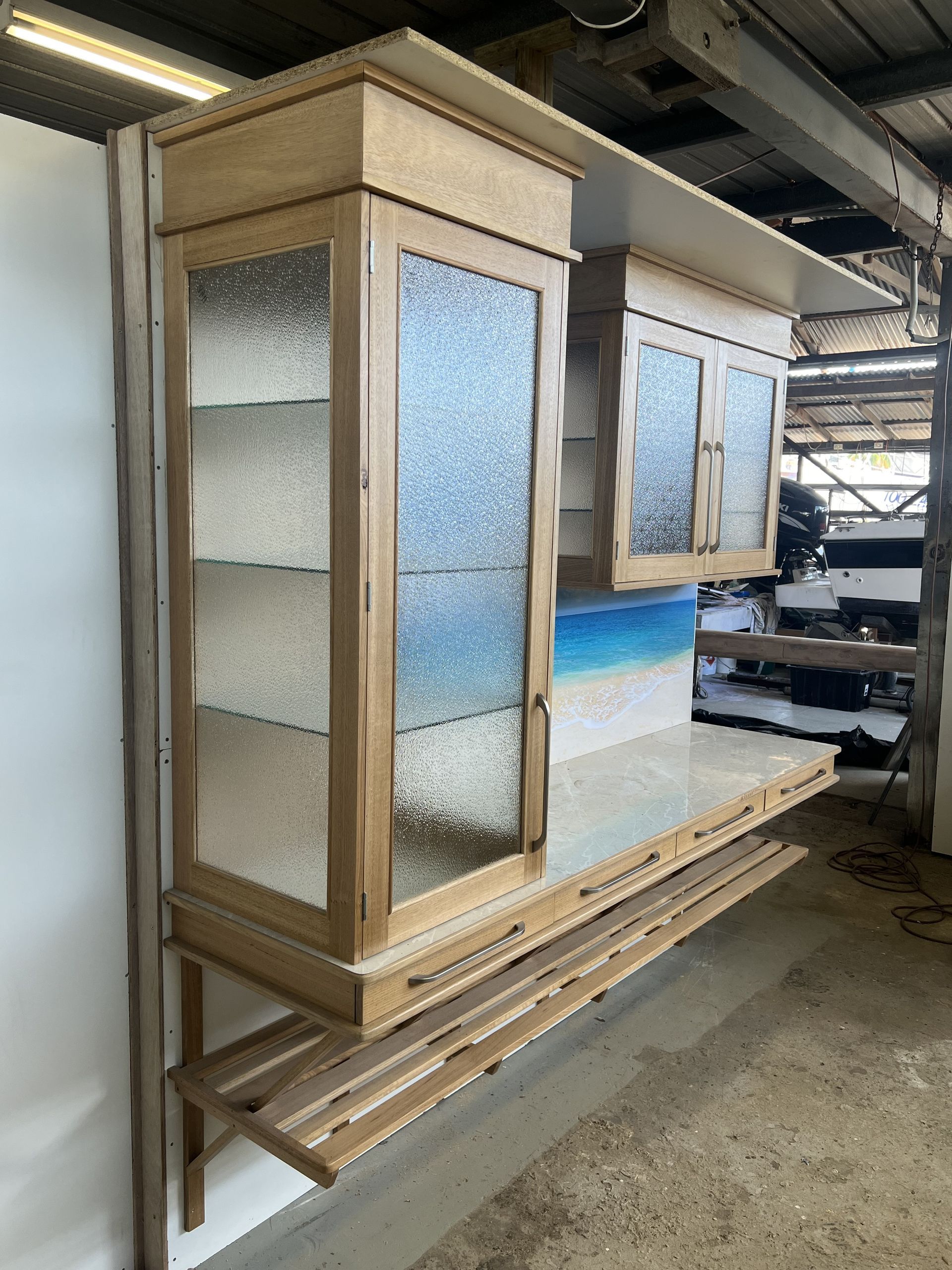A Kitchen With a Stainless Steel Counter Top and a Bag of Chips on It  — Tim Thomas Carpentry in South Townsville, QLD