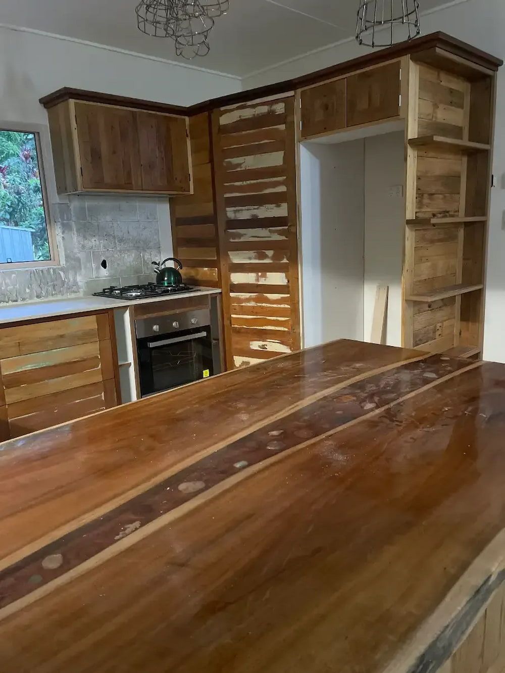 A Kitchen With Wooden Cabinets and a Wooden Counter Top — Tim Thomas Carpentry in South Townsville, QLD