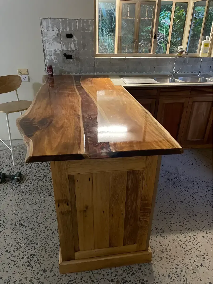 A Kitchen With White Cabinets, a Sink, a Stove, and a Window — Tim Thomas Carpentry in South Townsville, QLD