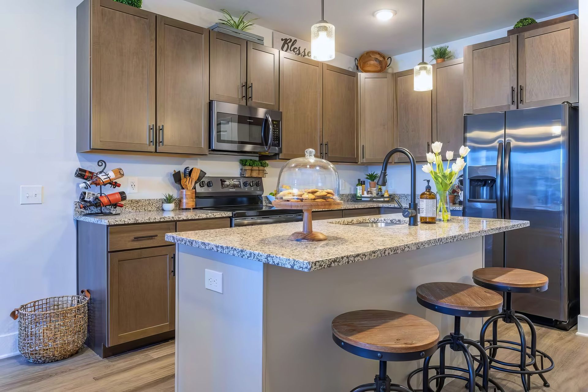 Contemporary kitchen with top-notch amenities in exclusive 1 bedroom apartment with kitchen island.