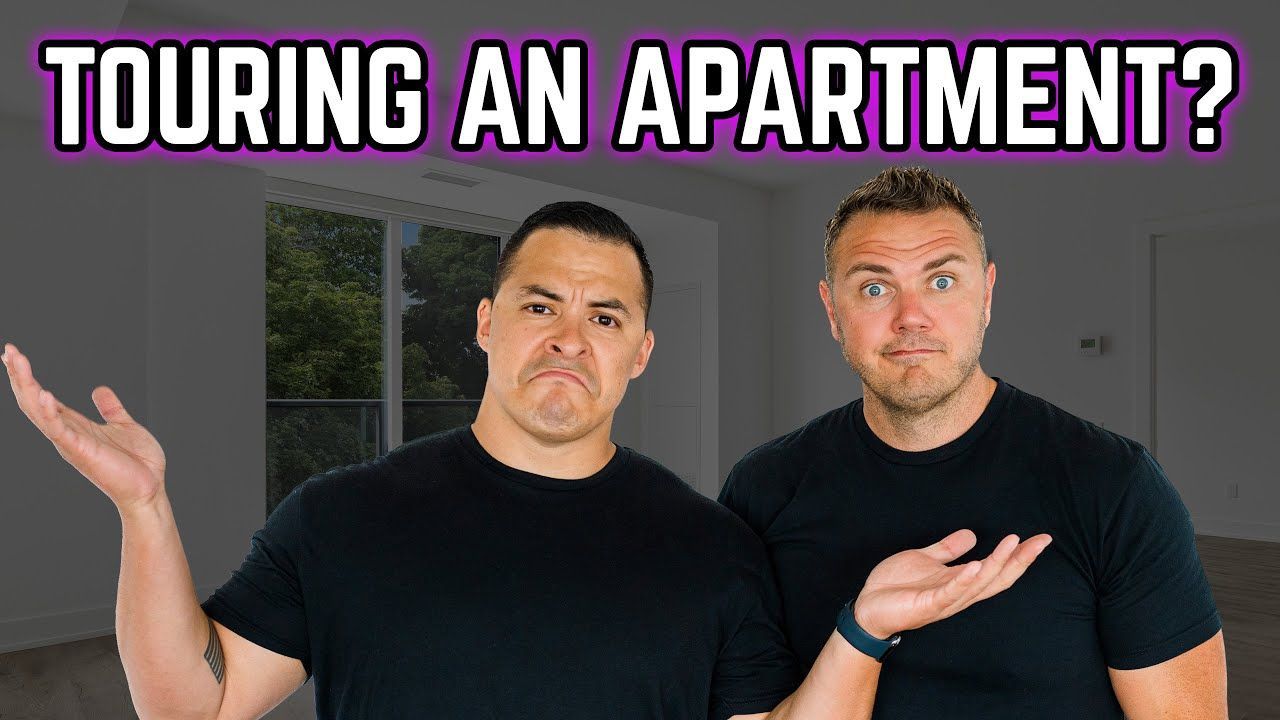 Two people touring an apartment
