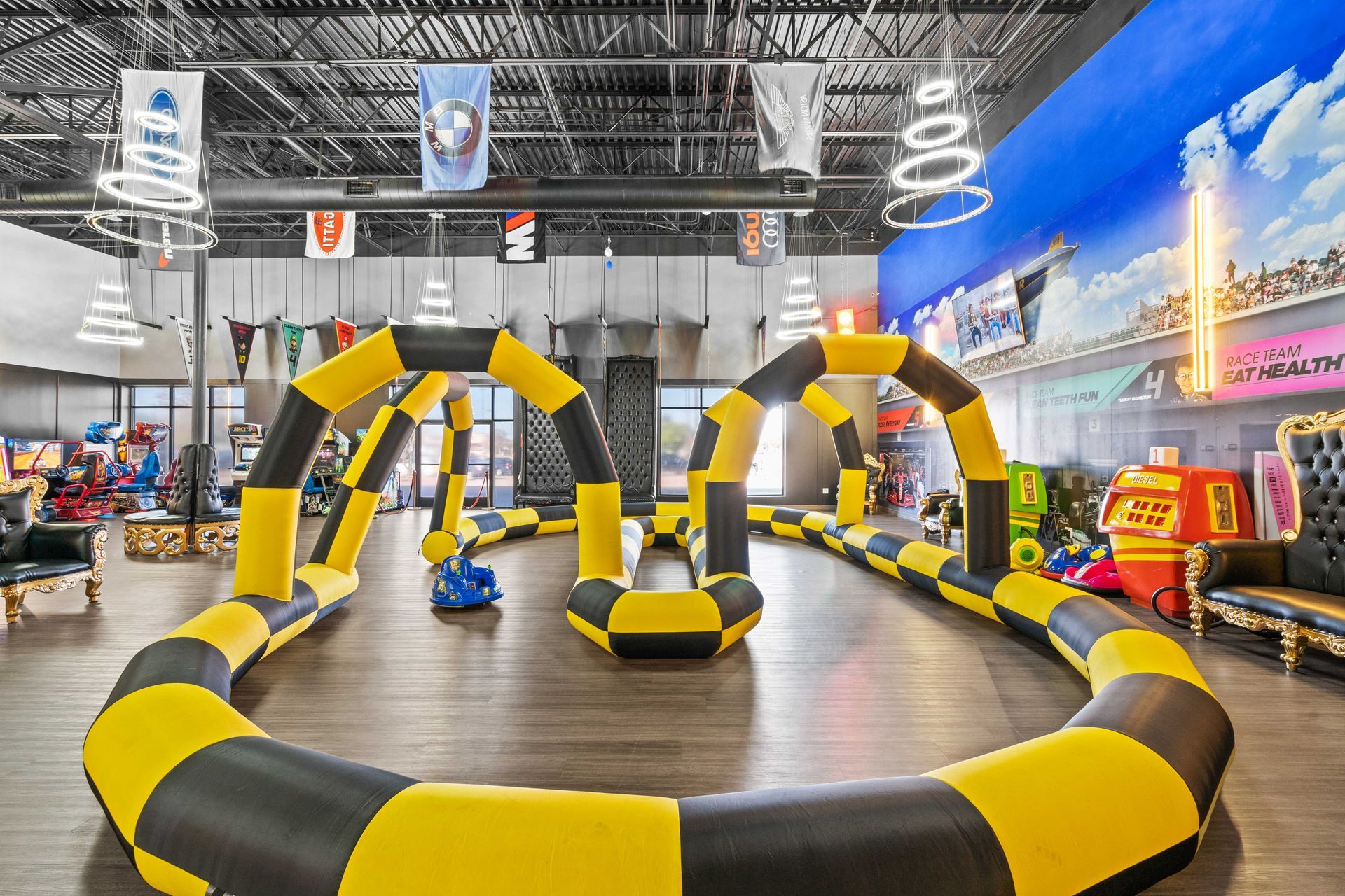 Grand Prix Dental in Katy, TX A yellow and black inflatable race track in a large room.