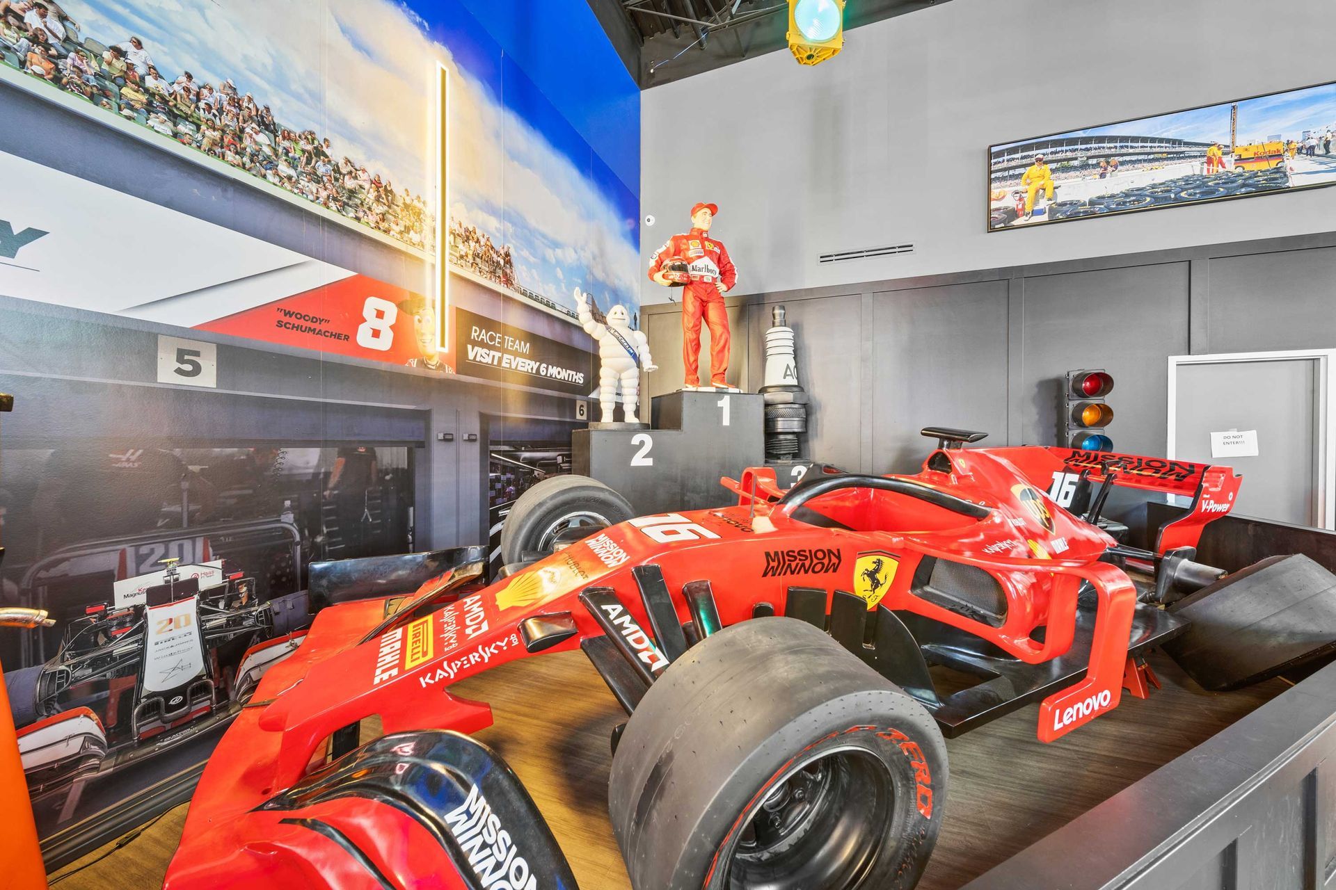 Grand Prix Dental in Katy, TX A ferrari race car is on display in a room.