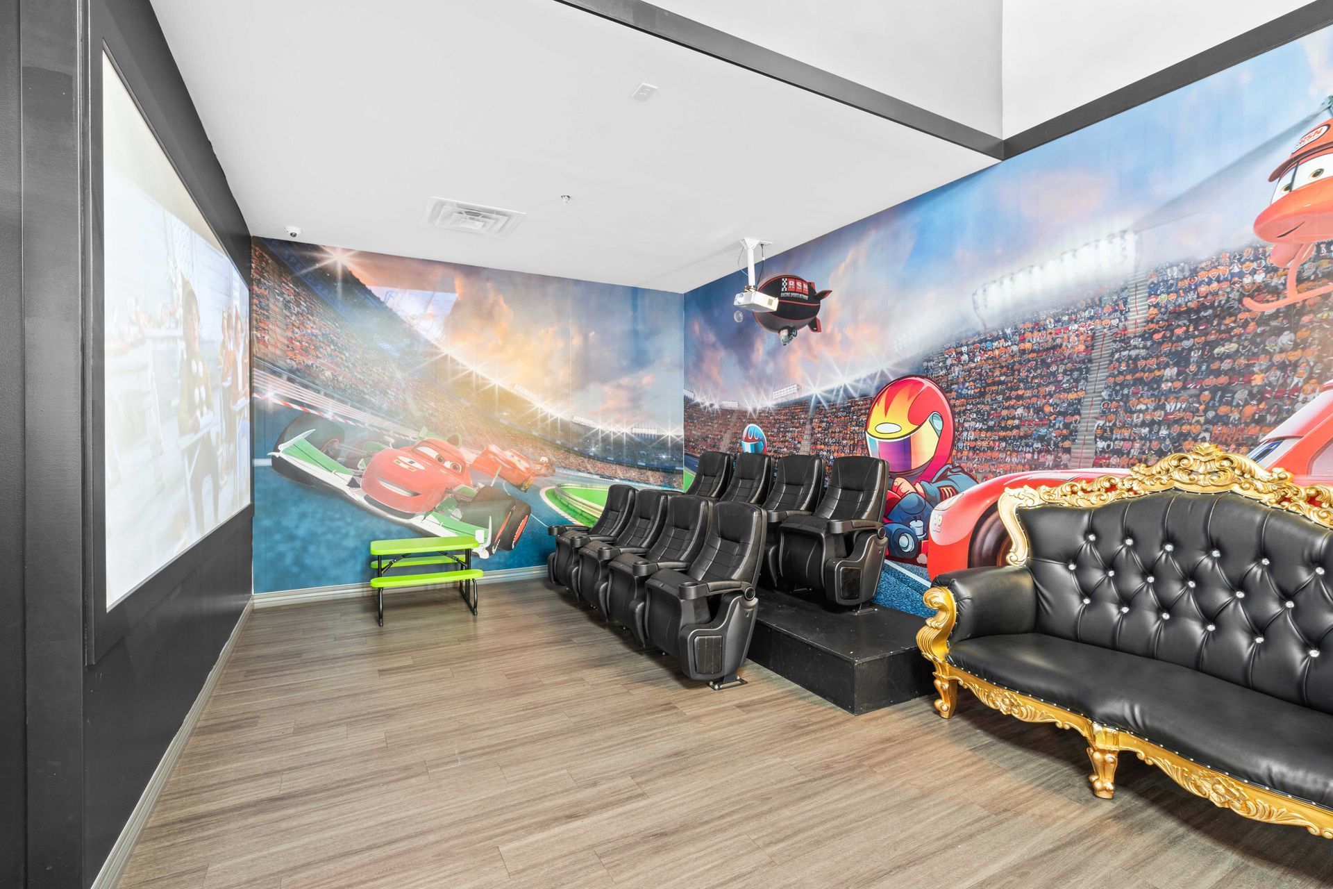 Grand Prix Dental in Katy, TX A living room with a couch , chairs and a projector screen.