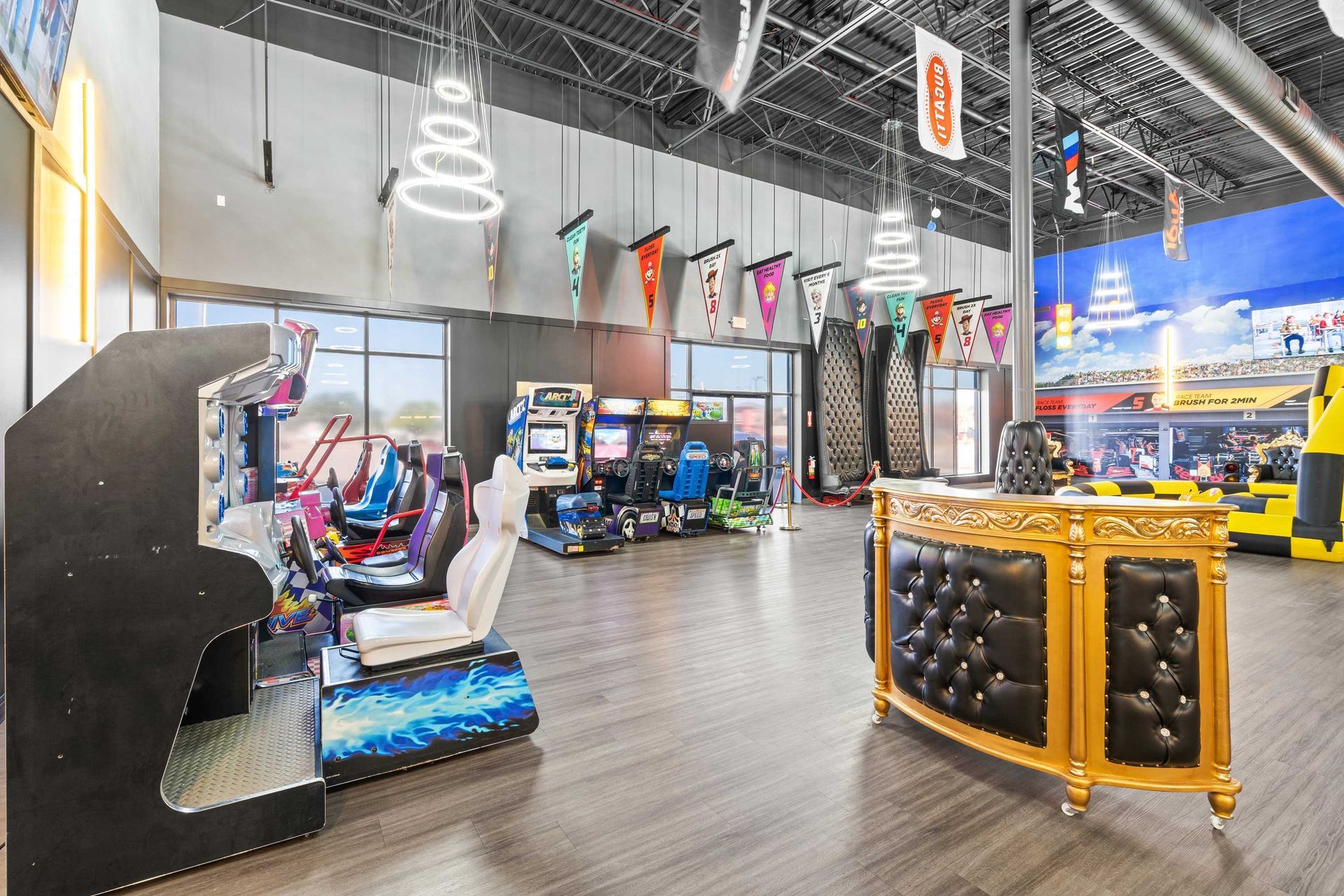 Grand Prix Dental in Katy, TX A large room filled with lots of arcade games and a bar.