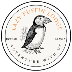 Lazy Puffin Lodge logo: puffin illustration within a circle, text