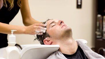 Man Having a Shampoo — Hair Services in Grayslake, IL