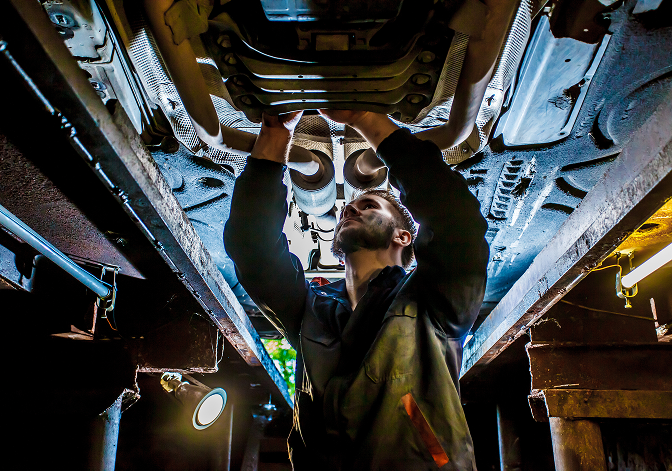 Mechanic working on a car | GenAuto