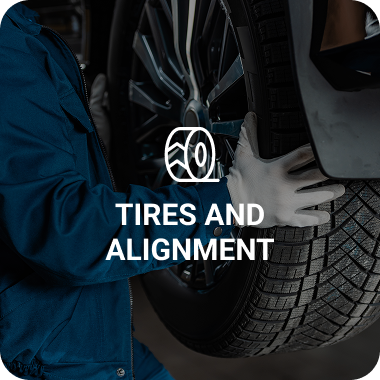 Mechanic changing a tire, text reads 