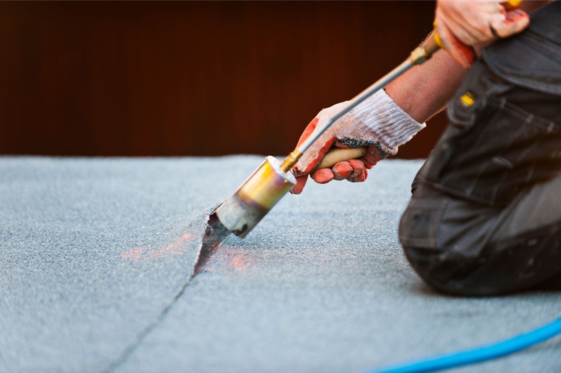 A person doing a roof repair in Bakersfield