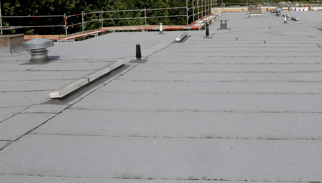 A roof with a lot of drains on it