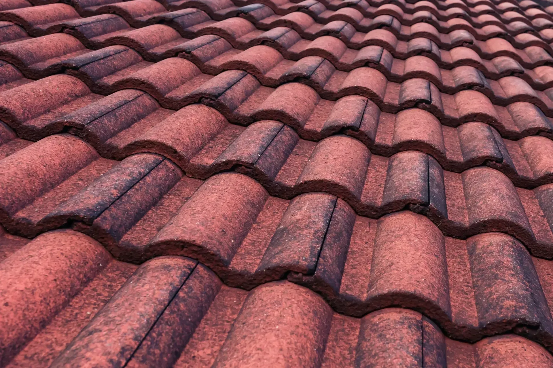 Construction worker tile roofing repair house