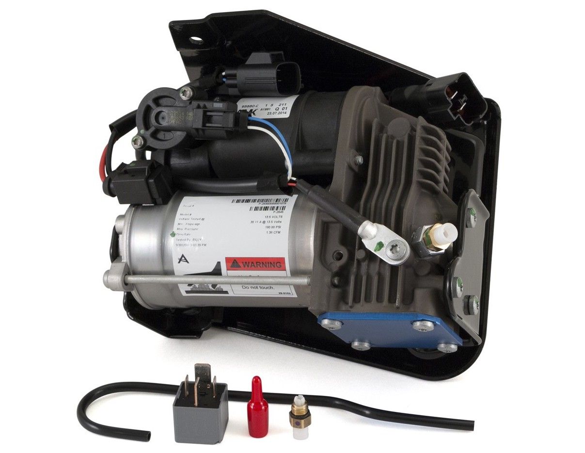 Air suspension compressor assembly with black cover, various connectors, and fittings.