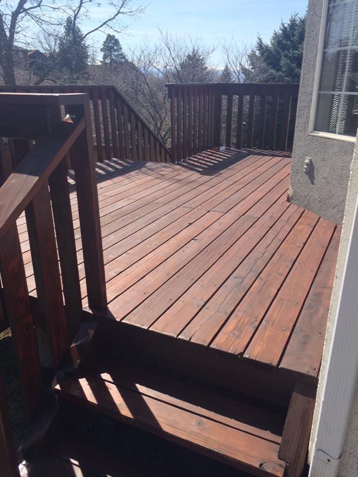 a wooden deck with stairs leading up to it