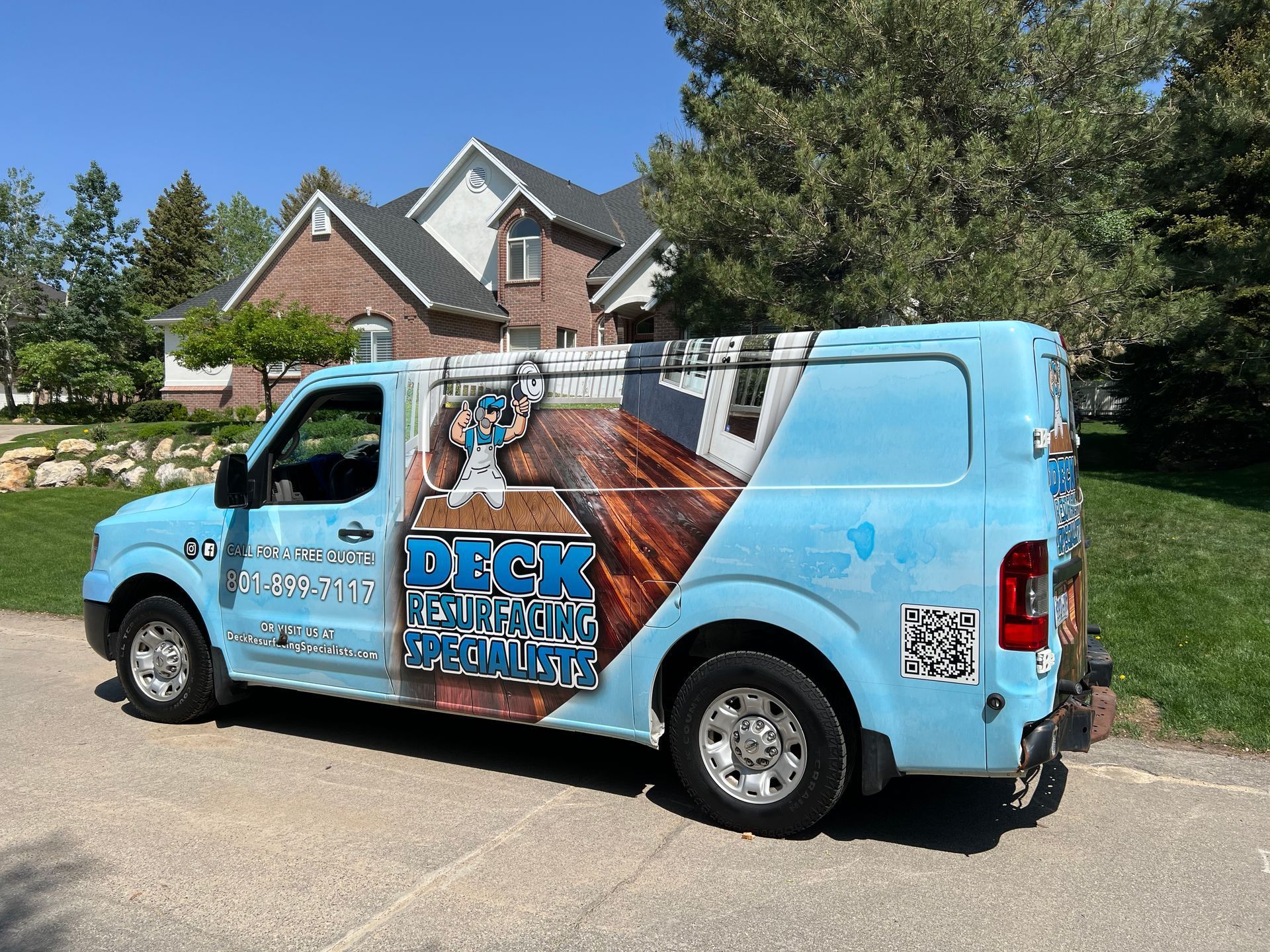 a blue van is parked in front of a house .