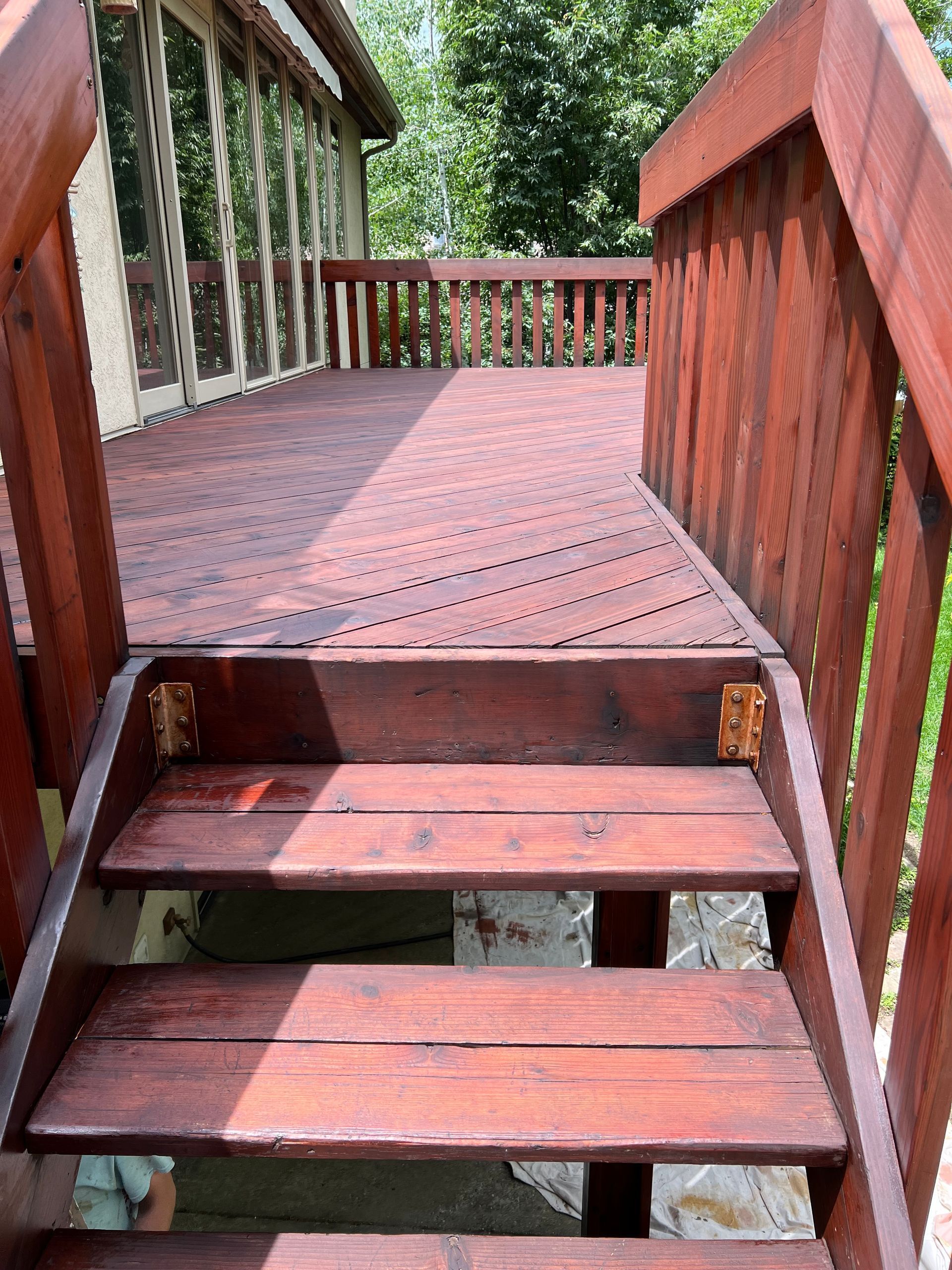 a wooden deck with stairs leading up to it