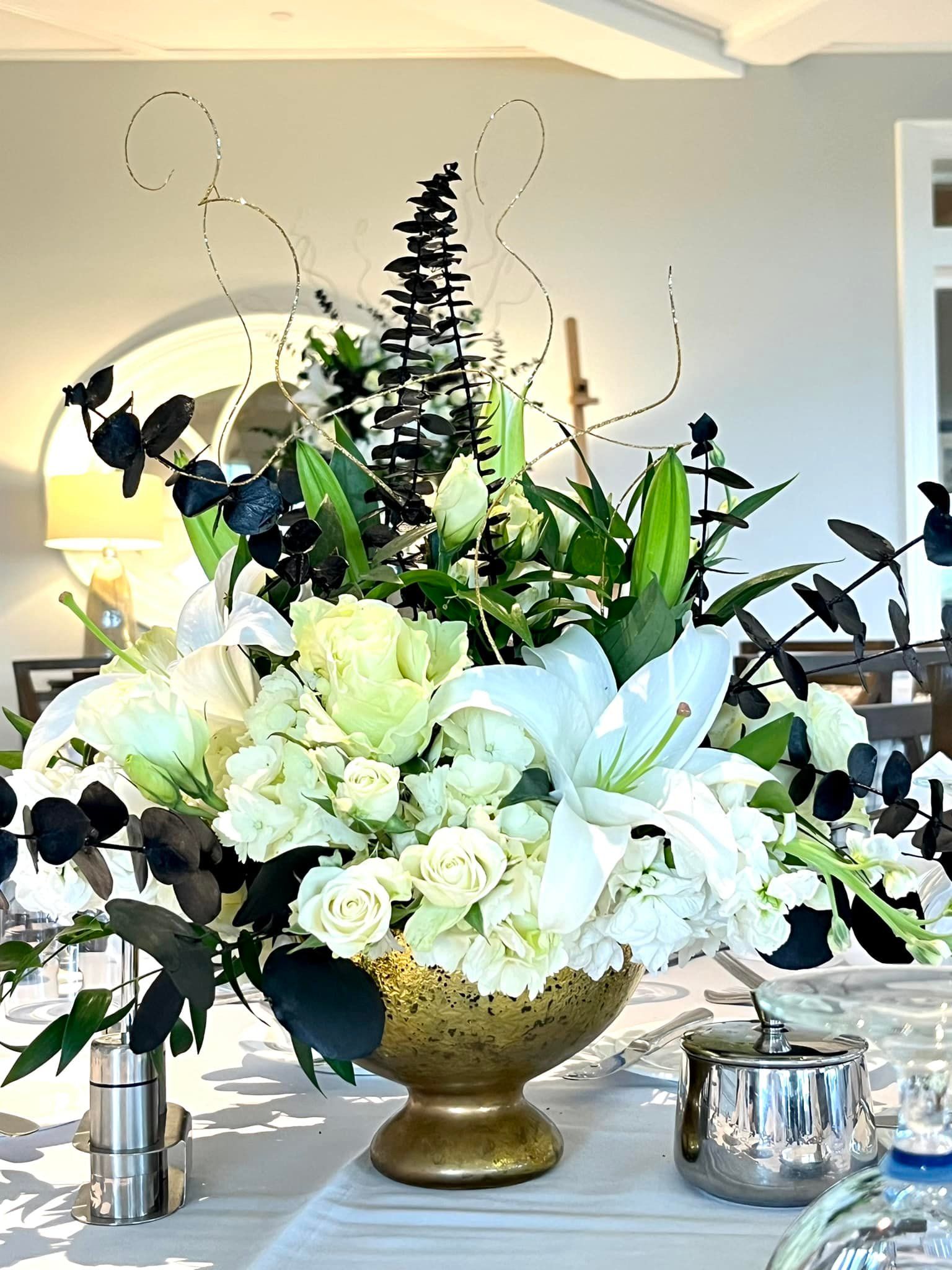 floral arrangement with white liles and roses