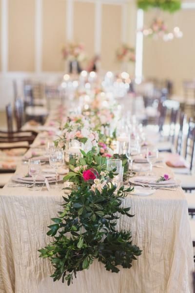 colorful floral table runner on wedding reception table