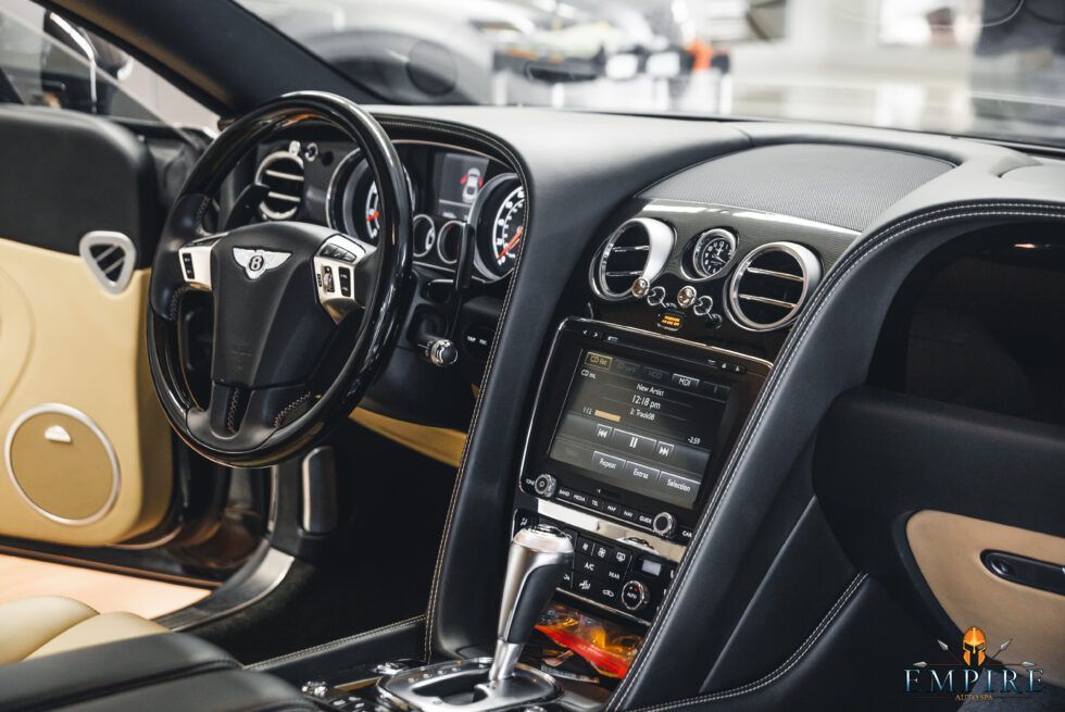 The interior of a bentley continental gt is shown.