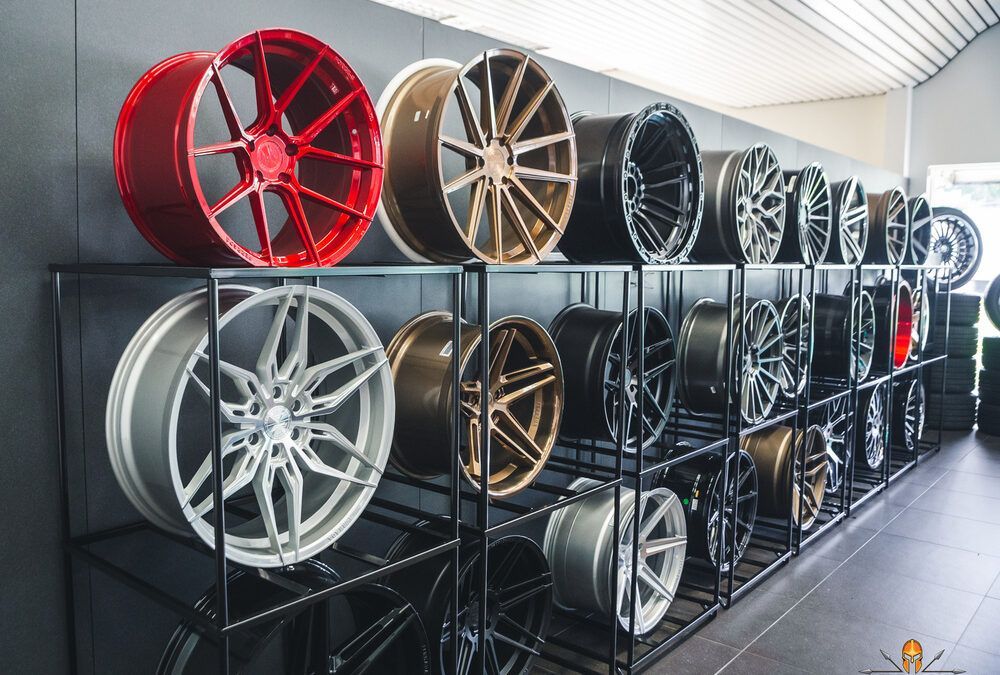 There are many different types of wheels on display in this store.