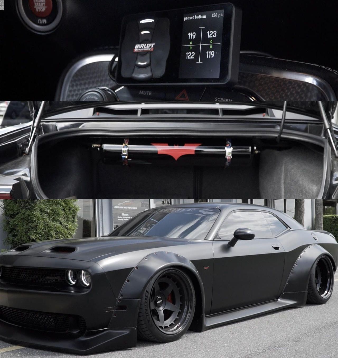 A black dodge challenger is parked on the side of the road