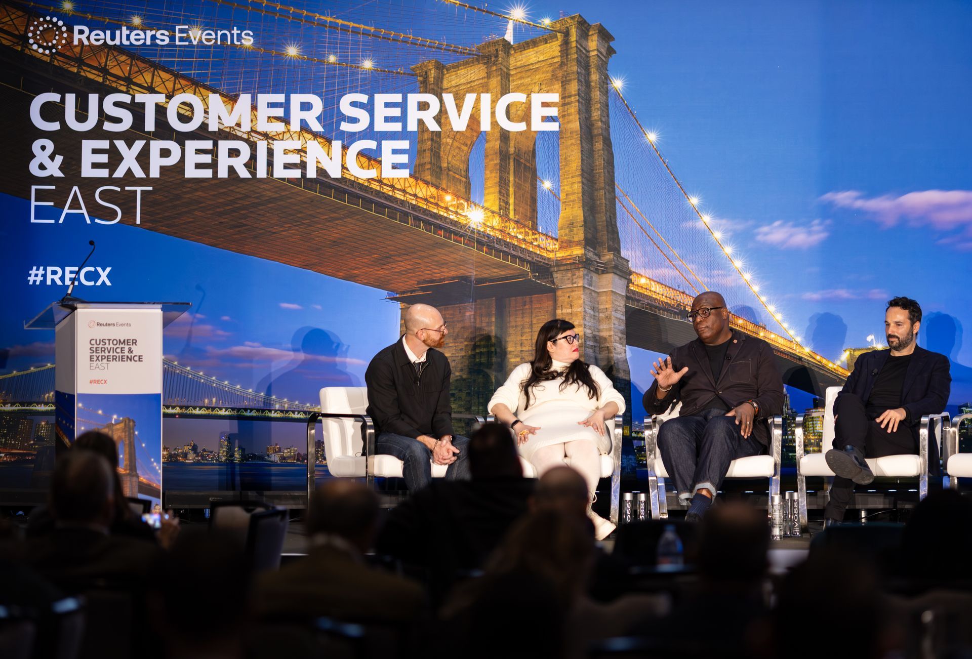 A man stands in front of a sign that says chief strategy officer summit