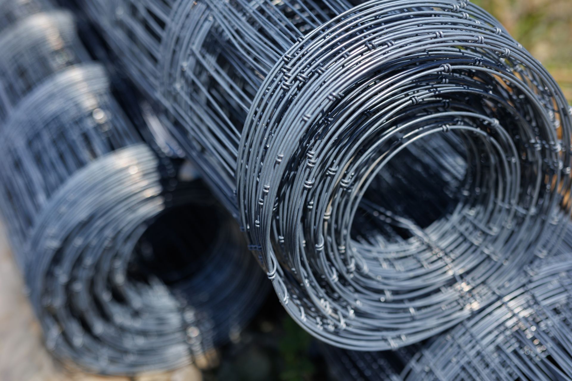 Close-up of a black wire roll, ideal for wire mesh projects and various construction uses. Close-up of a black wire roll, ideal for wire mesh projects and various construction uses.