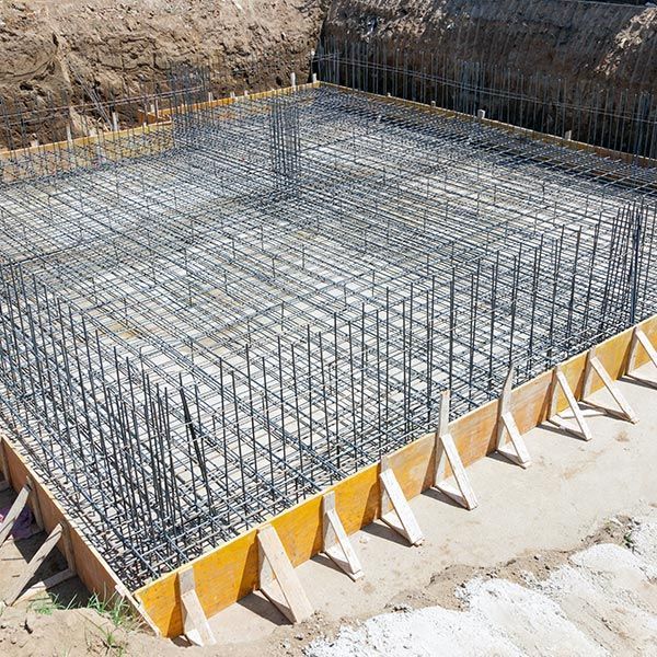Foundation of a new house, with the beginning of a construction with layers of gravel screen. Foundation of a new house, with the beginning of a construction with layers of gravel screen.